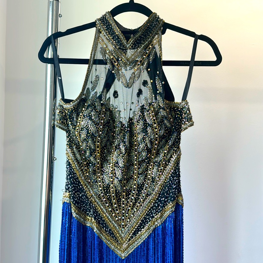 Blue sequin backless gown.